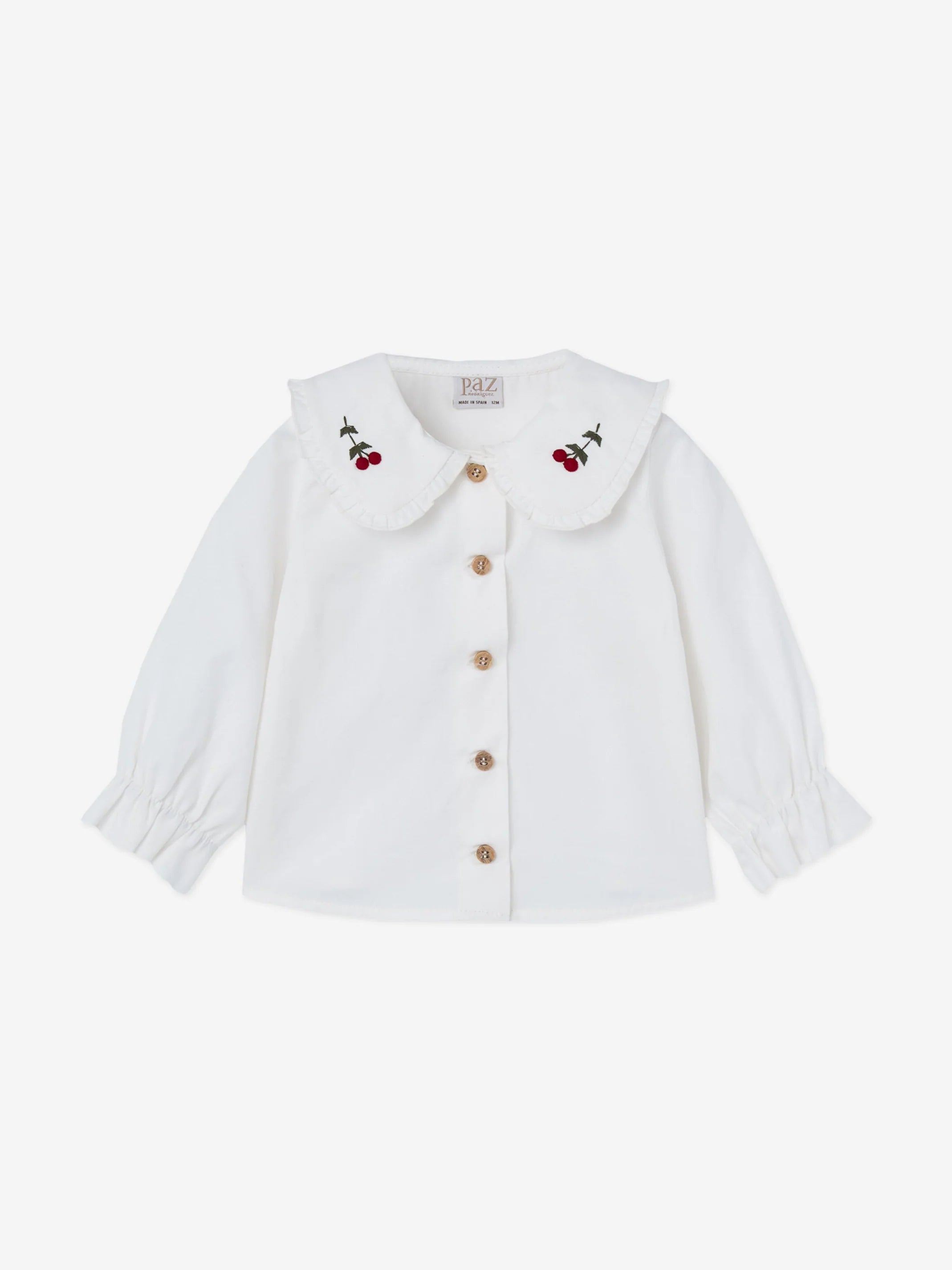 Pompon woven blouse.
