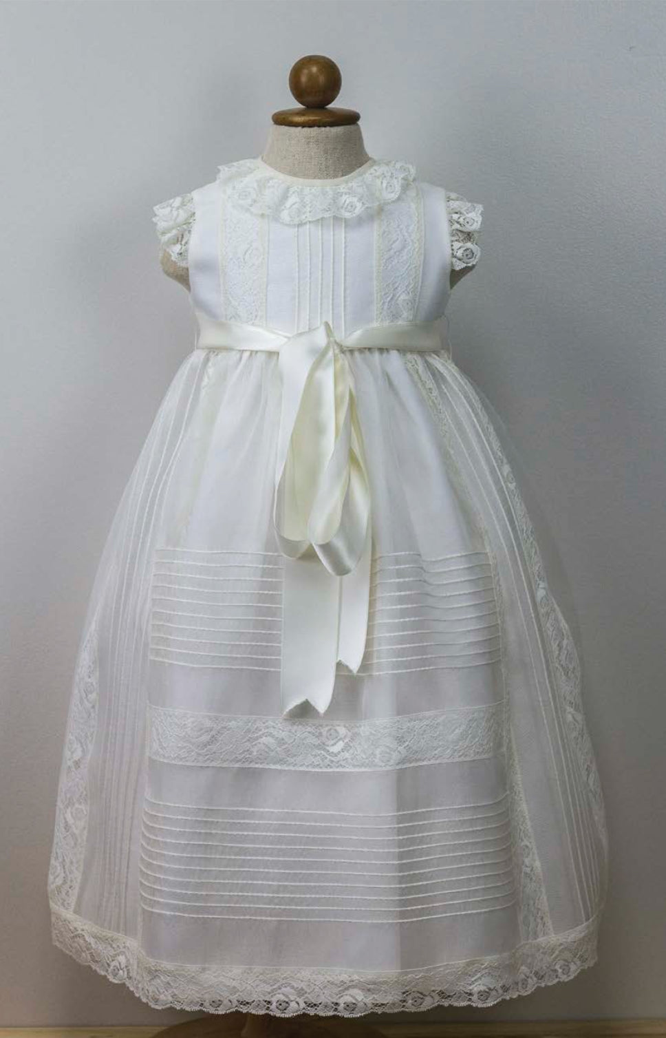 Elegant Christening Gown with Detailed Lace and Satin Ribbon