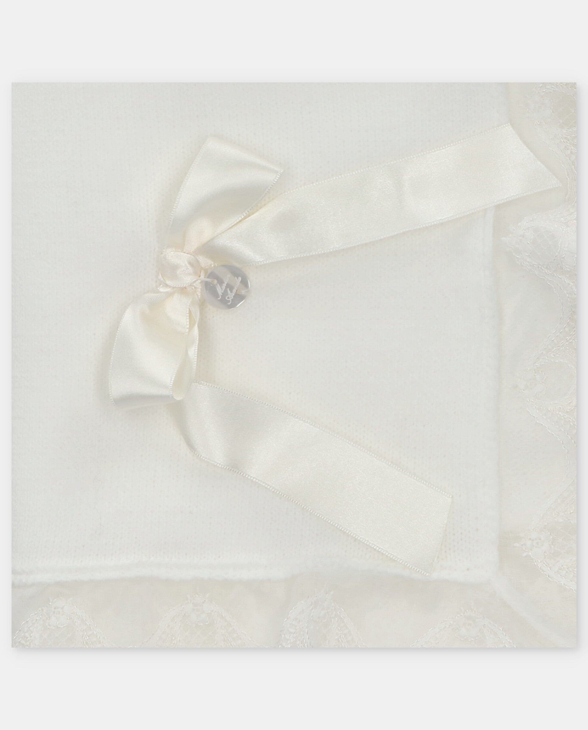Knitted blanket with bow