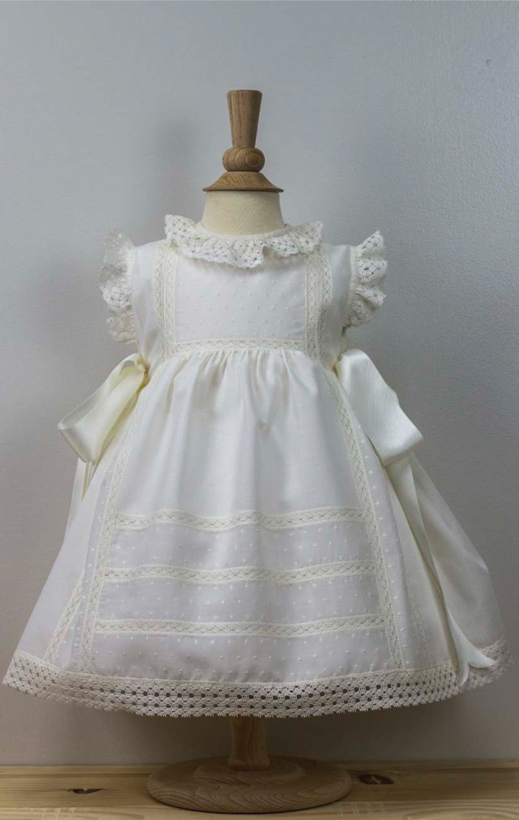 Charming Baby Dress with Lace Accents and Bow Details