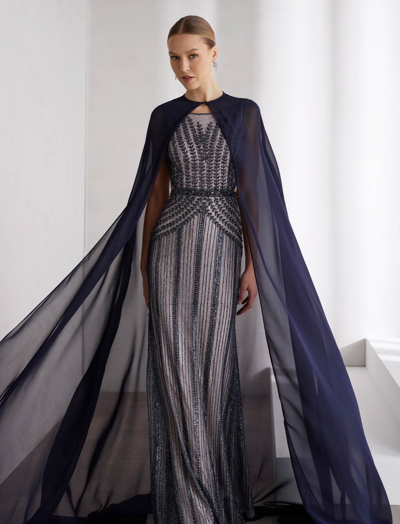 Beaded Gown with a Flowing Cape by Rosa Clará