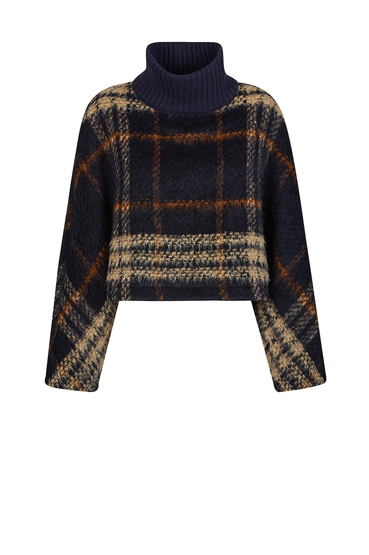 Cape with knitted turtleneck.