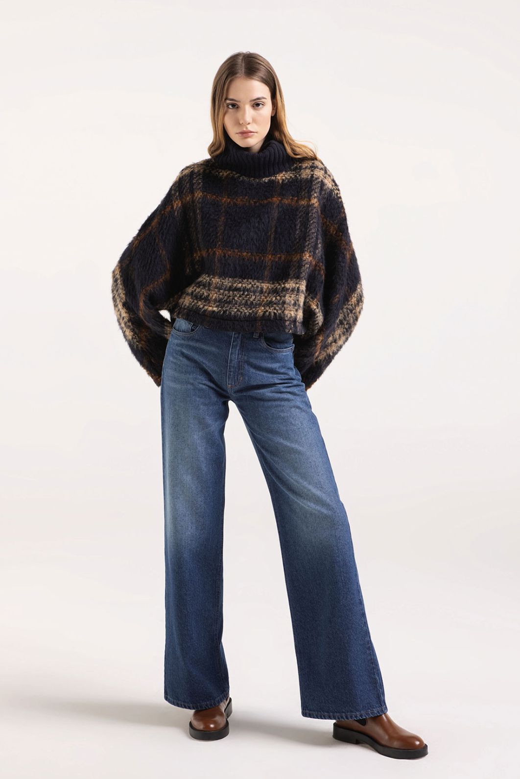 Cape with knitted turtleneck.