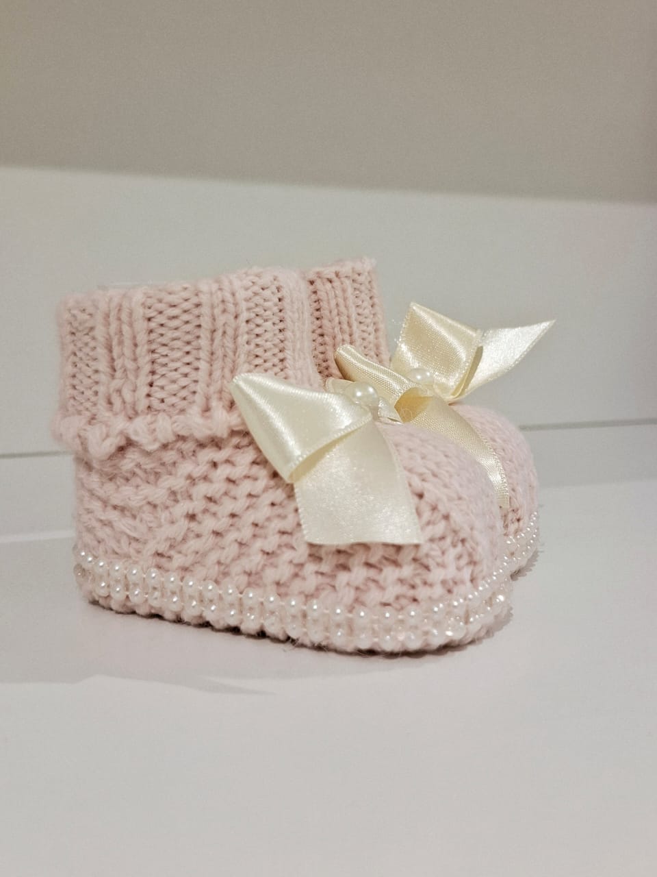 Knitted wool ribbon and pearl adorned boots