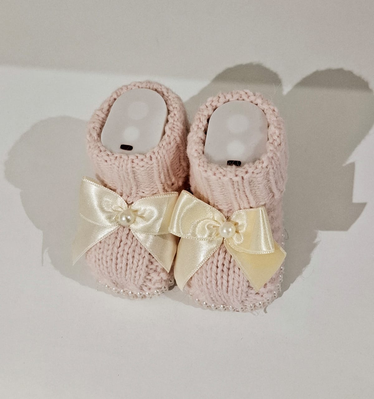 Knitted wool ribbon and pearl adorned boots