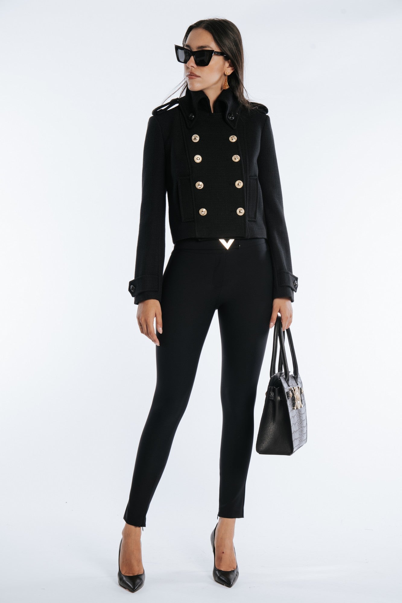 Slim fit pants with side zip and golden metallic detail
