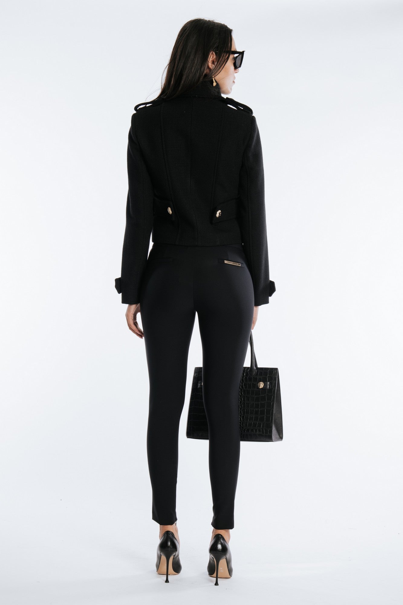 Slim fit pants with side zip and golden metallic detail