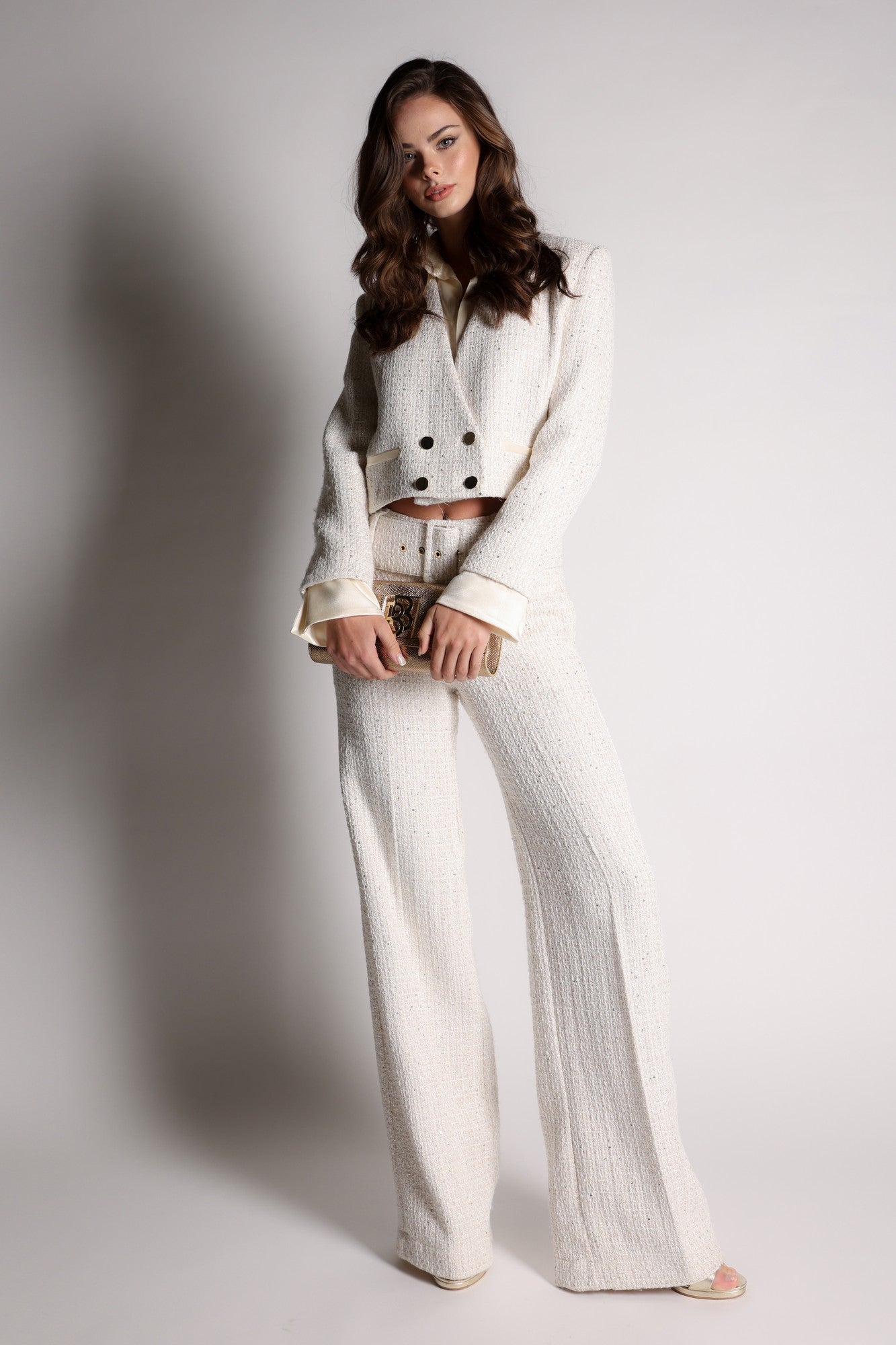 Tweed crop blazer with satin collar and cuffs.