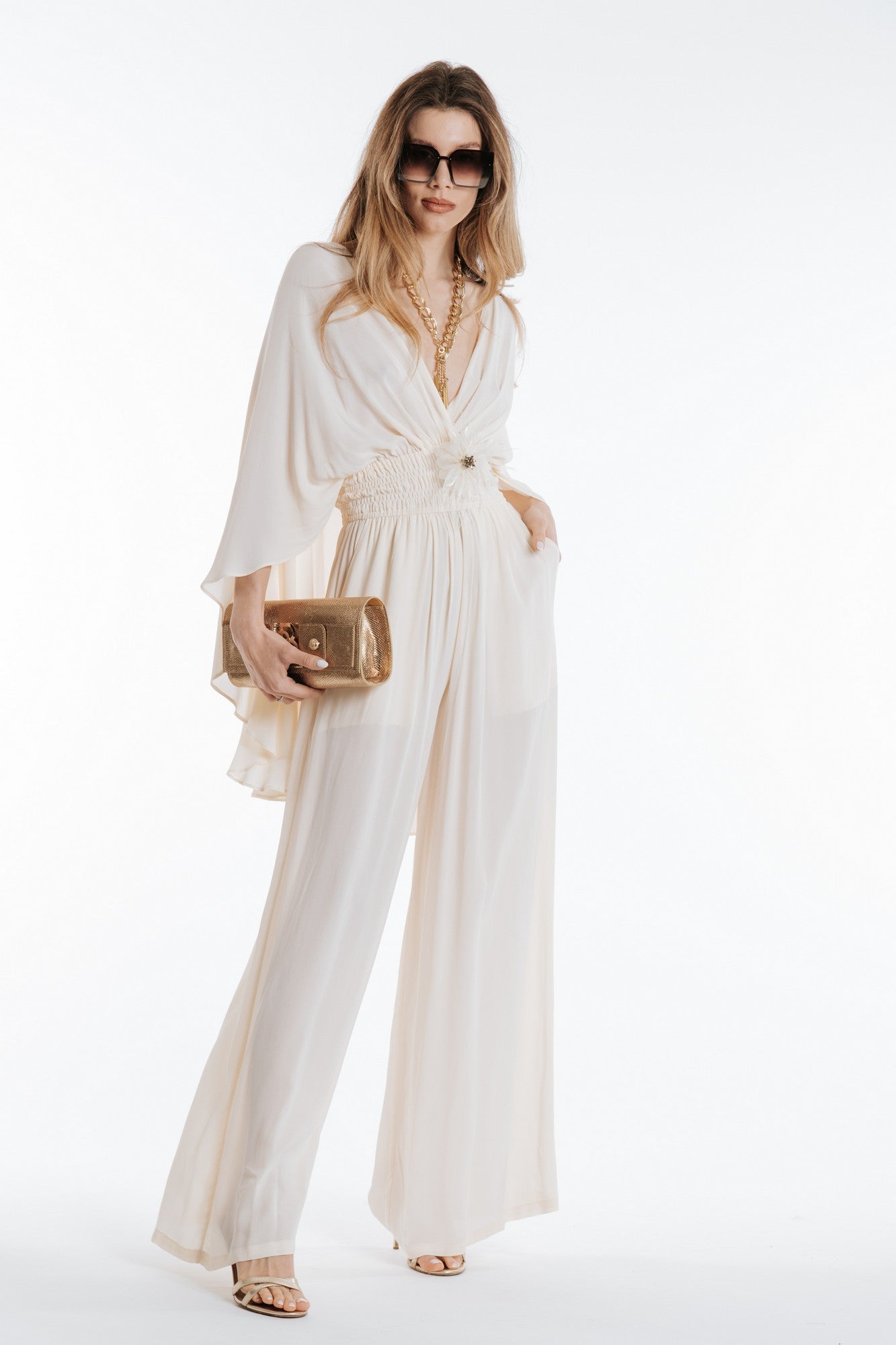 Jumpsuit with cape and removable flower